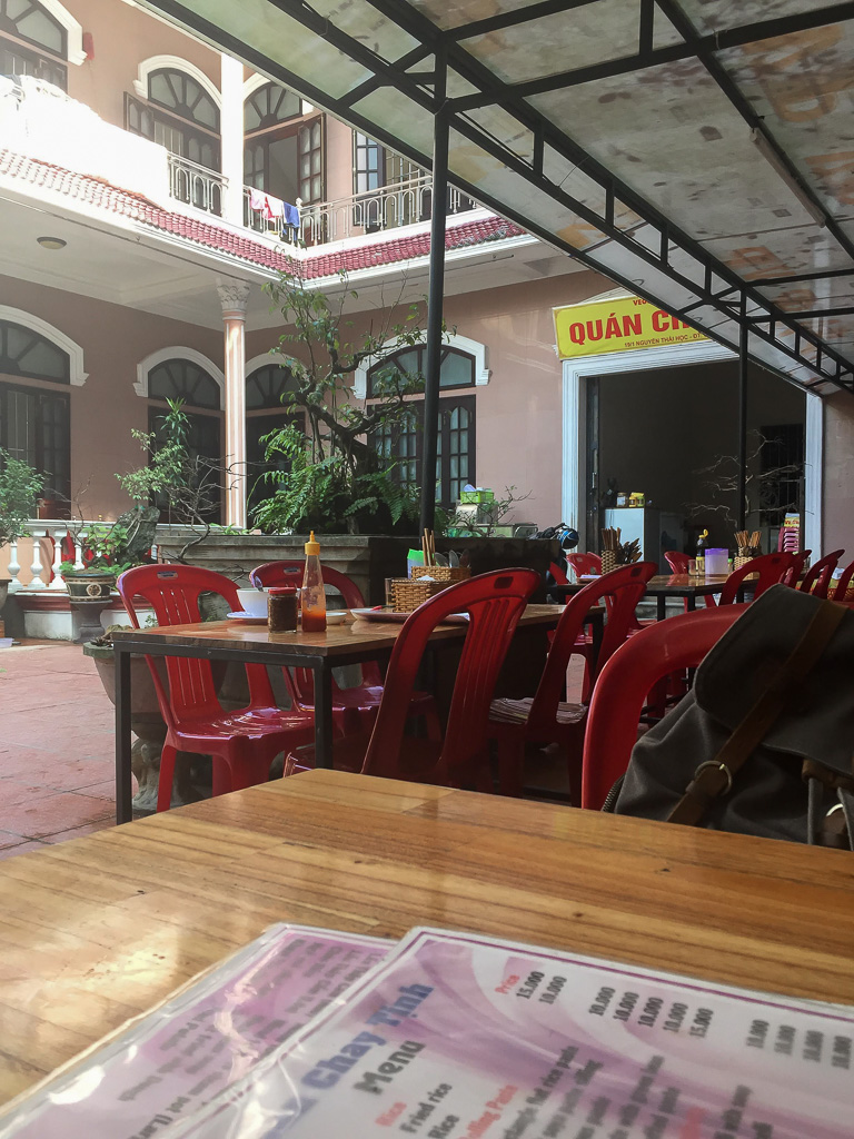 A small courtyard with a local vegan restaurant in Hue, Vietnam.