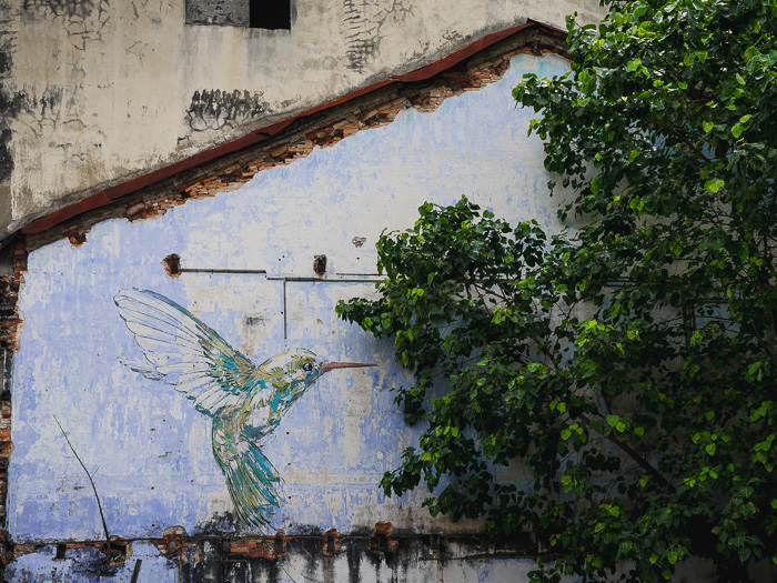 A mural of a bird in Ipoh Old Town.