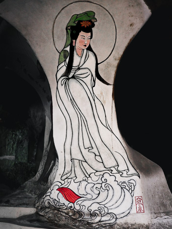 A painting of a woman inside Perak Tong cave temple.