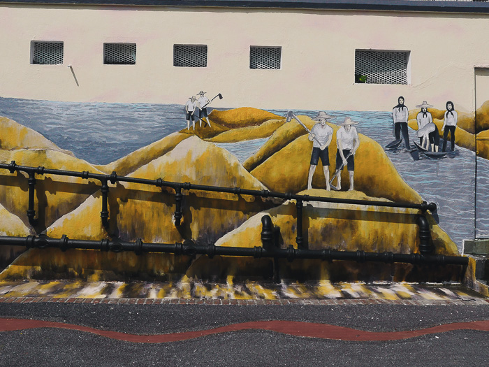 A mural of workers in the field.