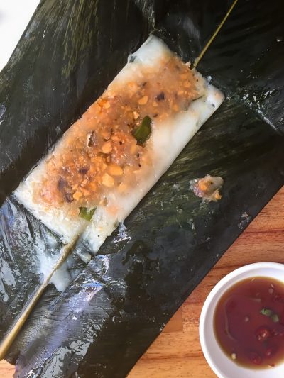 Vegan Vietnam, Hue: a flat-steamed gelatinous rice served wrapped in a thick leaf.