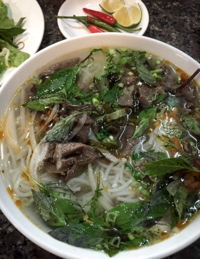 A huge steaming bowl of delicious veggie Bun Bo Hue.