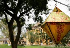 A red and yellow lantern with the words "Hue Vietnam" written on it.